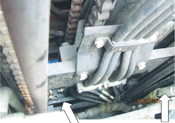 Photo of forklift mast hoses and chain drive mechanism.