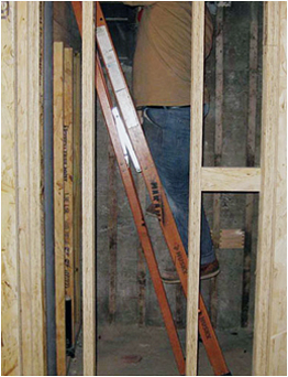 man standing on a rung while the ladder is closed