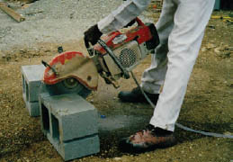 Photo of handheld masonry saw in use