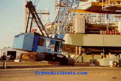 Photo of crane tipping over
