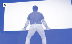 photo of man lifting drywall