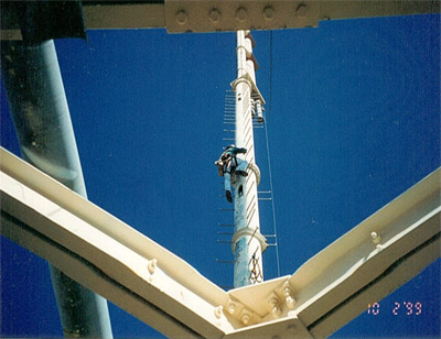 Photo of person climbing tower