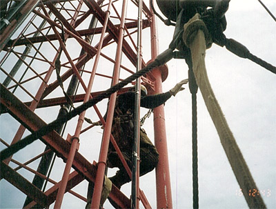 Photo: Climber is attached with fall protection lanyard and positioning device.