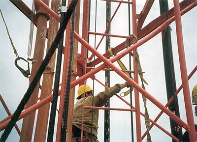 Photo: climber is transferring from one anchorage point to another.