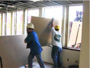 Teamwork used for loading carts via hatch access.