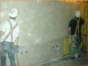 Two-worker panel lifting.