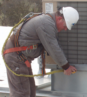  photo of worker attaching fall protection