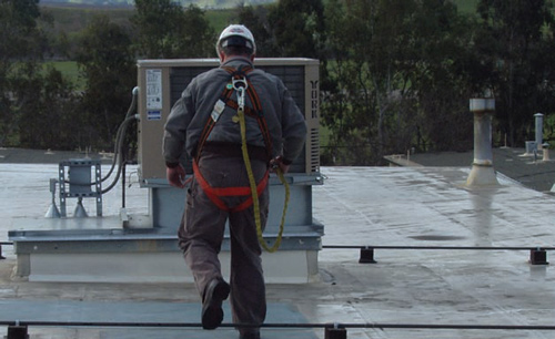 photo of a worker with incorrect fall protection