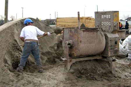 Traditional method of transporting grouting using buckets.