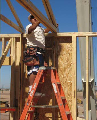 Figure 3 - Platform ladders can be set up inside a structure and used to install roof trusses.