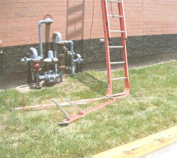 close up of ladder's lower section which is bent