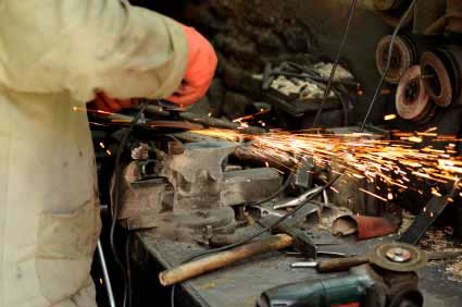 photo of someone grinding metal