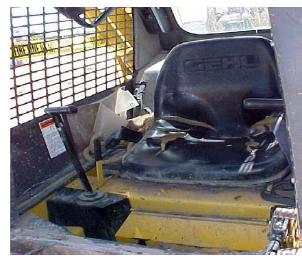 Photo of damaged skid steer forklift