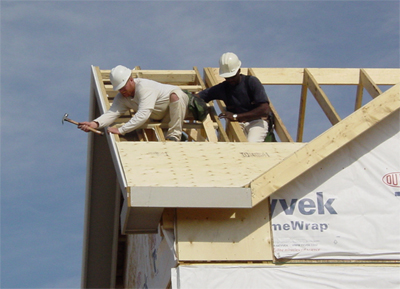 Men on a roof in danger of a fall from the height.