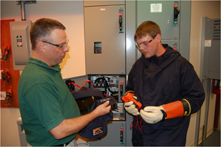 Man training a younger worker.