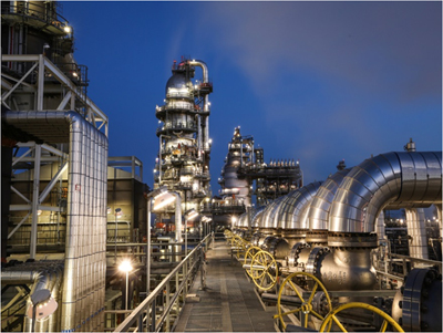 Lit area with pipes for a waste management plant or other. Photo courtesy of International Brotherhood of Boilermakers.