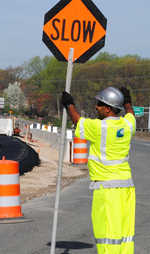 worker guiding traffic