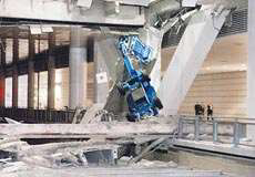 photo showing a structural collapse under the weight of machines