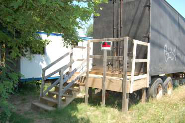 stairyway and platform to the back of a loading truck