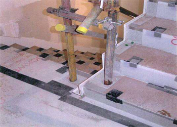 Photograph of a stairway with sockets for guard rails