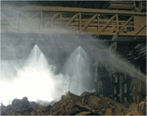 This is a picture of water spraying down an invironment that has silica dust