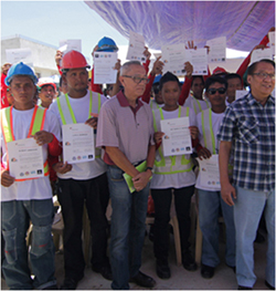 This is a picture of a group of construction workers who have earned a certificate from a training