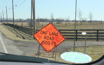 This is a picture of road signage near the accident that reads: One Lane Road 1500 FT