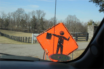 This is a photo of a flagger warning sign on the road