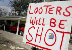 Looters will be shot sign in front of house