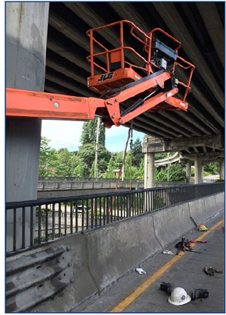 Incident scene showing the aerial lift after being 
struck by a truck.