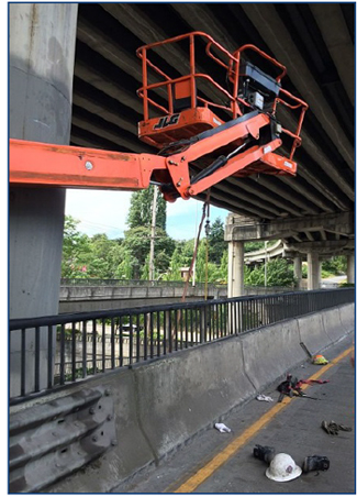 Incident scene showing the aerial lift after being 
struck by a truck.