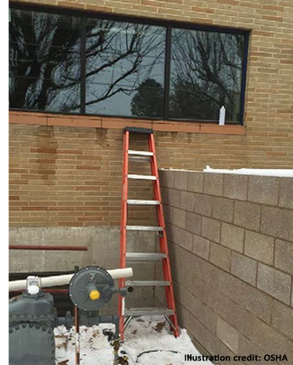 Incident scene showing the 8-foot stepladder from which the victim fell over the wall into a stairwell below. 