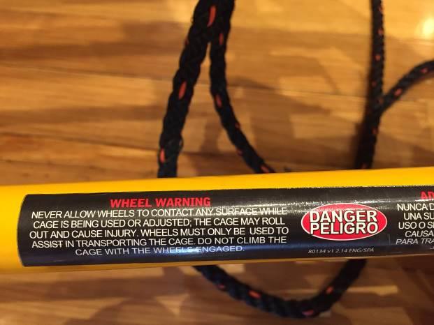 photo of warning label on the wheel lift assembly