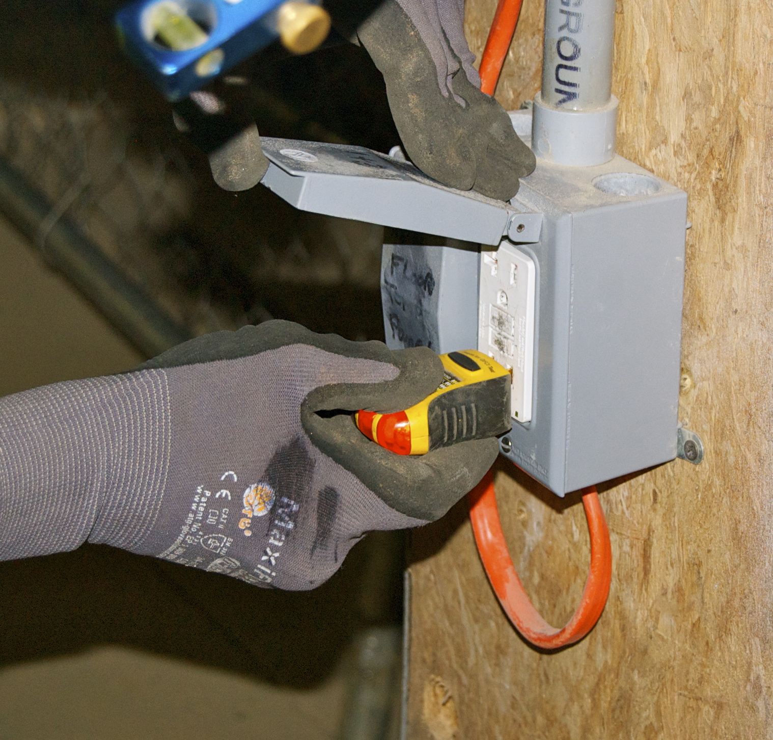 Checking outlet with GFCI Tester